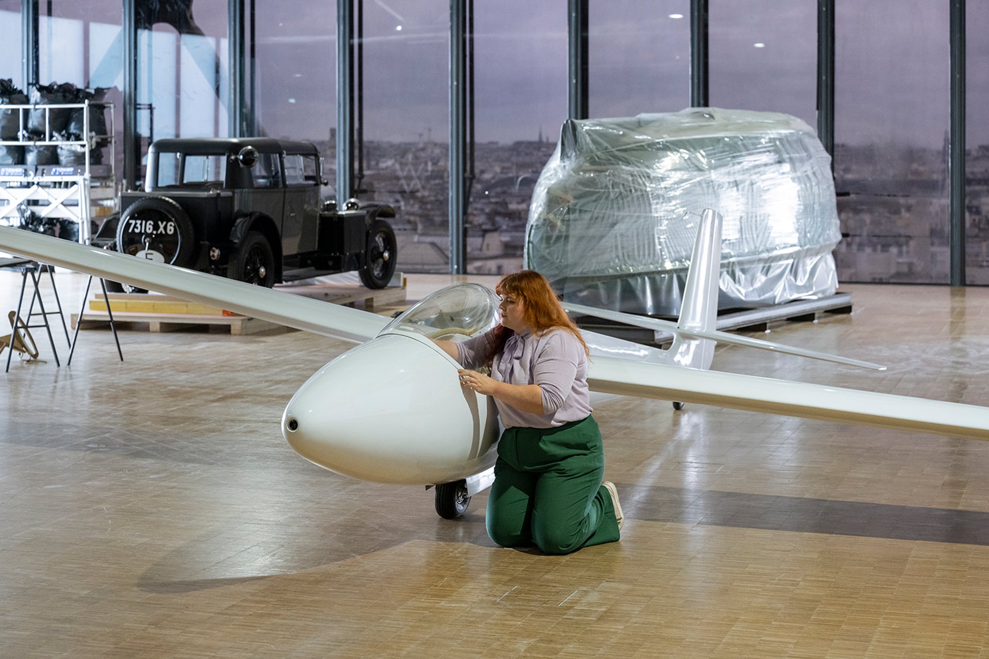 The glider, Dymaxion and Voisin C7 Lumineuse being installed in the empty exhibition space, before any of the other objects, models and artworks arrived.