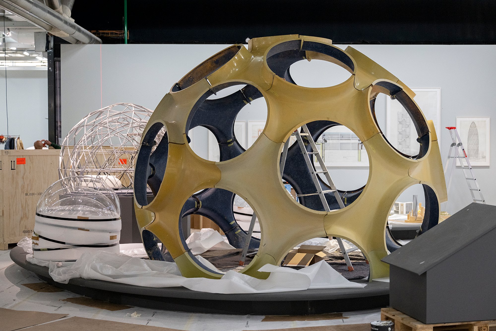 Building Buckminster Fuller's 12-foot Fly's Eye Dome, which is made from Fibreglass. Norman Foster was working with Buckminster Fuller and his collaborator John Warren at the time they produced this 12-foot prototype, which has since been bought from the Fuller Estate for The Norman Foster Foundation.