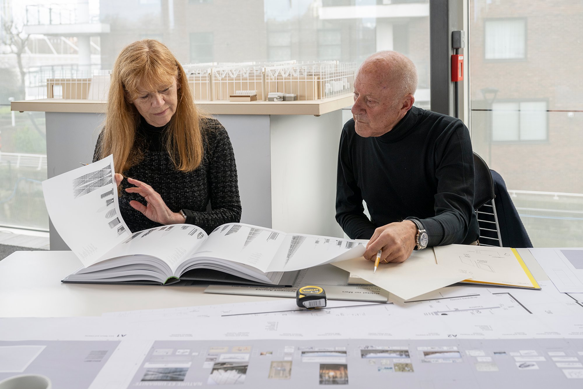 Reviewing projects for 'The Vertical City' in the practice's London studio. This section of the exhibition explores the skyscraper, which Norman Foster says is "emblematic of the modern age city and a reminder that the city is arguably civilisation’s greatest invention." 