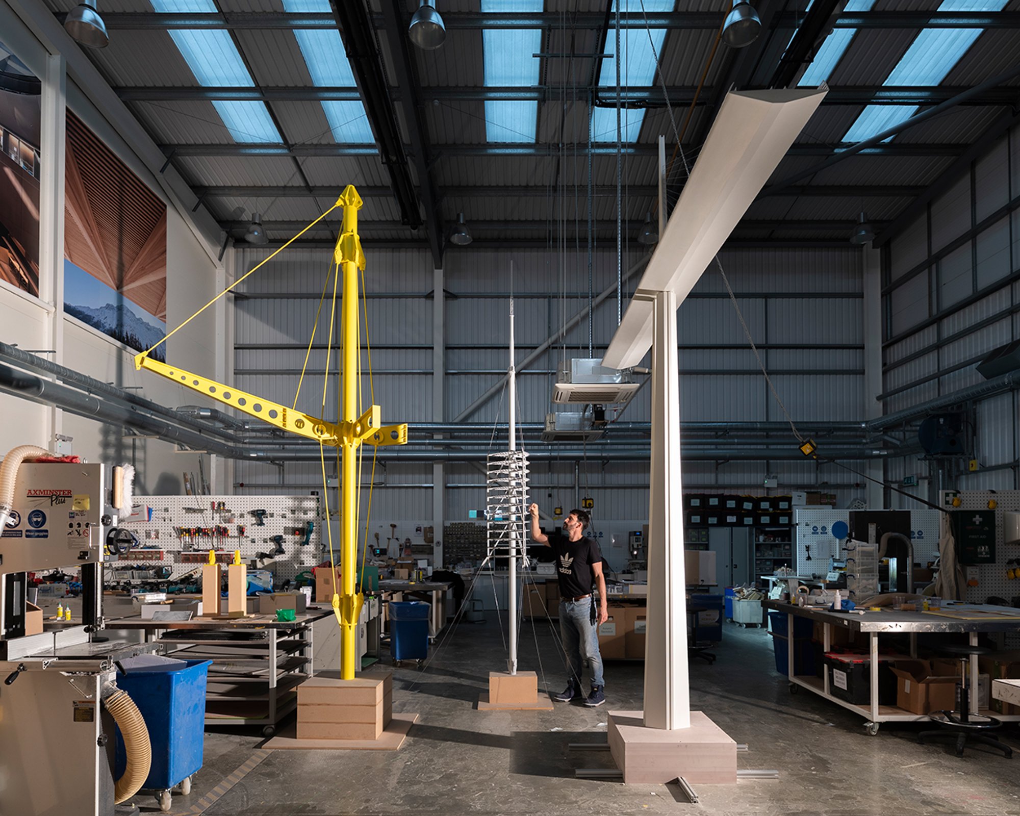 Building structural models in the practice's London workshop, before they were transported to the Centre Pompidou. These scaled models of the Renault Distribution Centre's yellow skeleton, Torre de Collserola and the Millau Viaduct (left to right), were made especially for the exhibition.