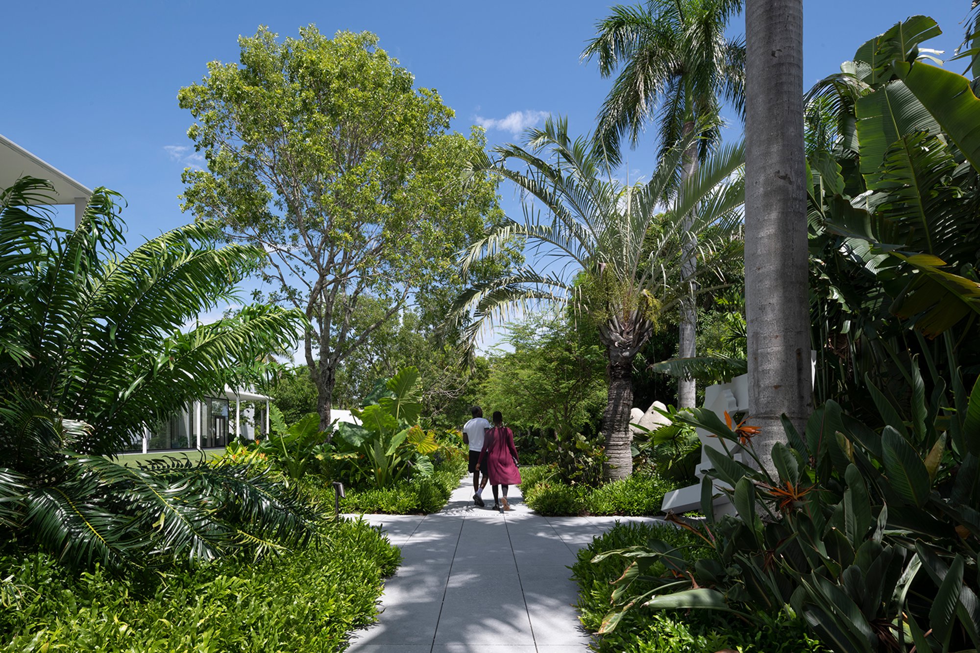 The landscaping of the Norton Museum of Art's gardens and central courtyard incorporates native trees and flowers to provide shaded walkways.